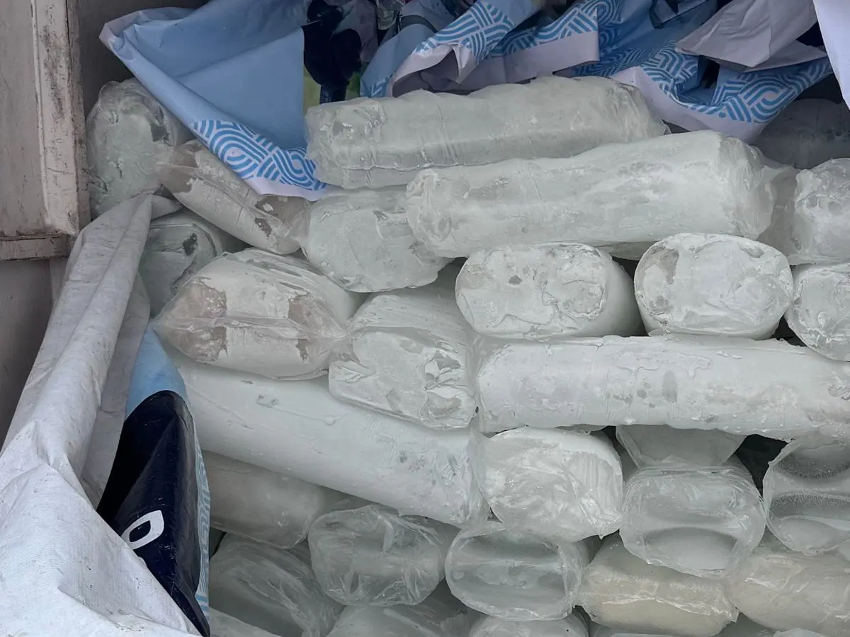 Wrapped Boss Ice blocks stacked in the back of a delivery van.
